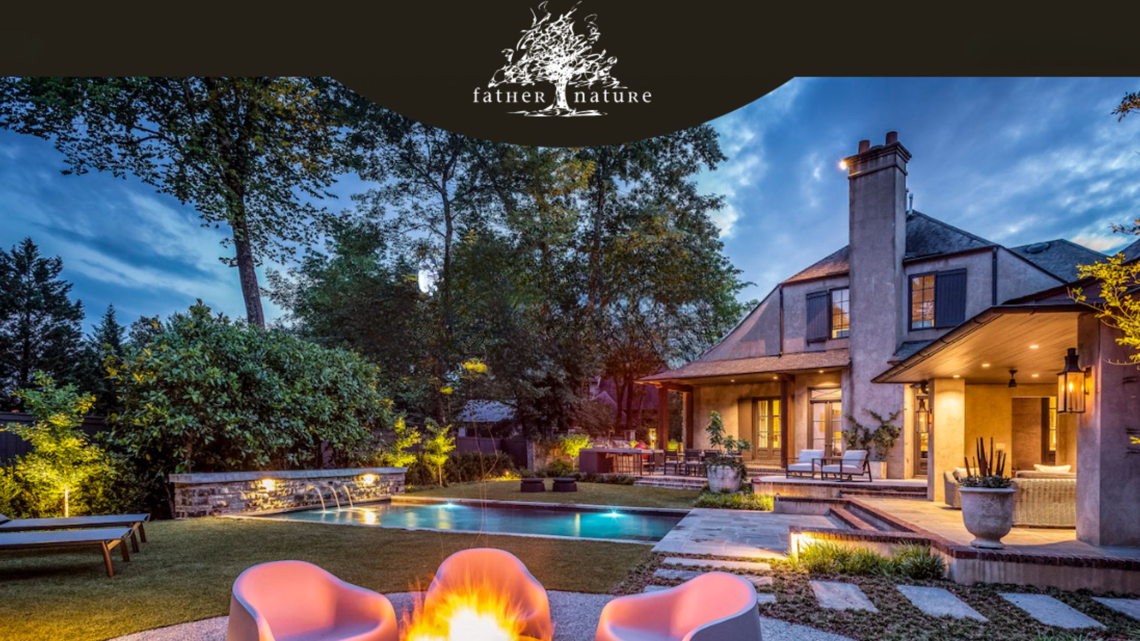 A beautifully lit backyard featuring modern lounge chairs around a fire pit, a swimming pool, lush greenery, and a house at dusk.