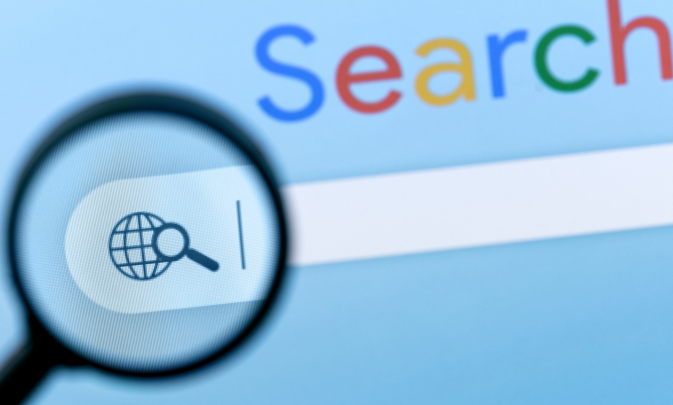 A magnifying glass focuses on a search engine's icon and search bar under the word "Search" with a blue background.
