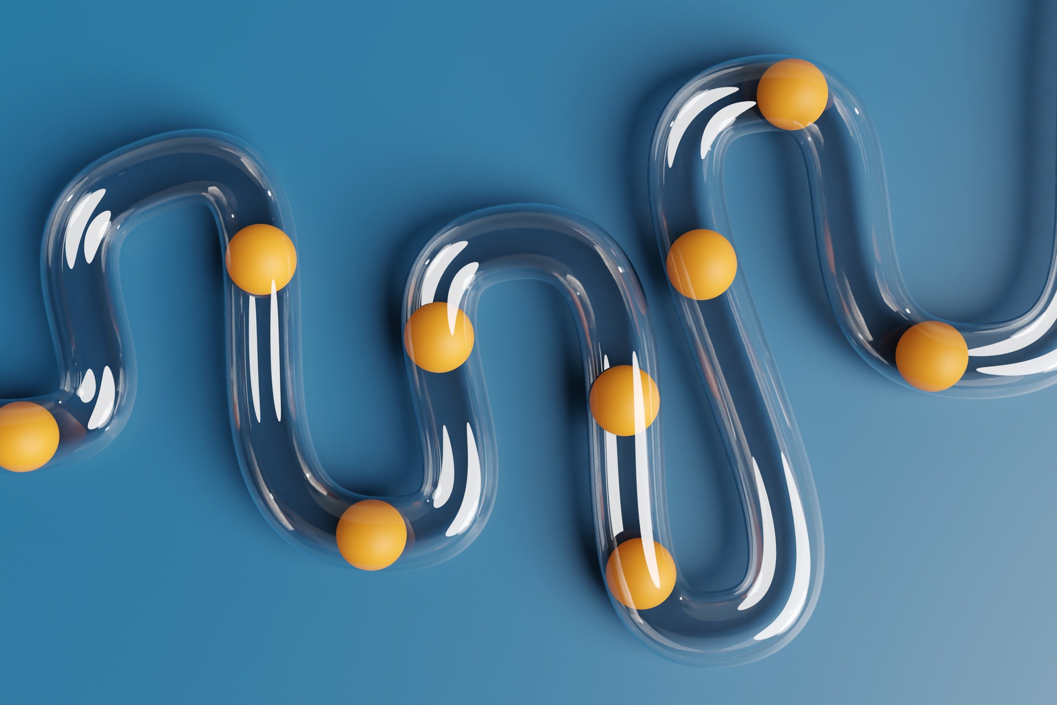 ransparent plastic tube being blocked by orange balls on blue background. Illustration of the concept of digestive disorders and difficulties on career paths